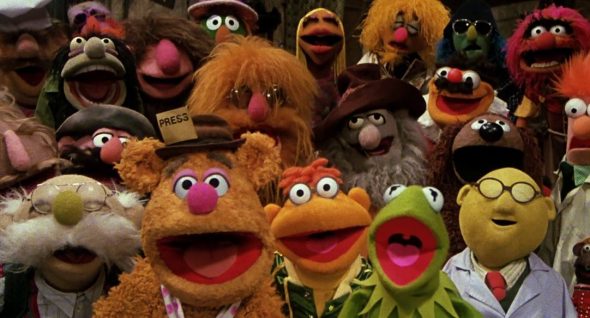 The Muppets smile at the camera at the end of the "Happiness Hotel" number.