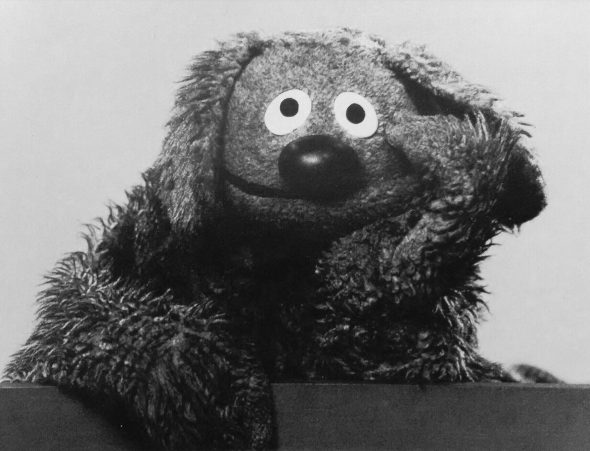Rowlf, with his head in hand, looking tired.