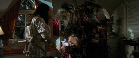 Screenshot from Labyrinth: Sarah and the Junk Lady in the junk bedroom.