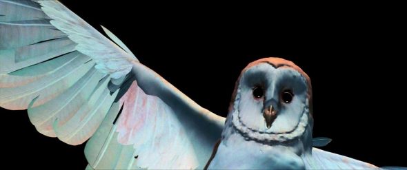 Screenshot from Labyrinth: The CGI owl flies up to the camera and makes eye-contact with you.