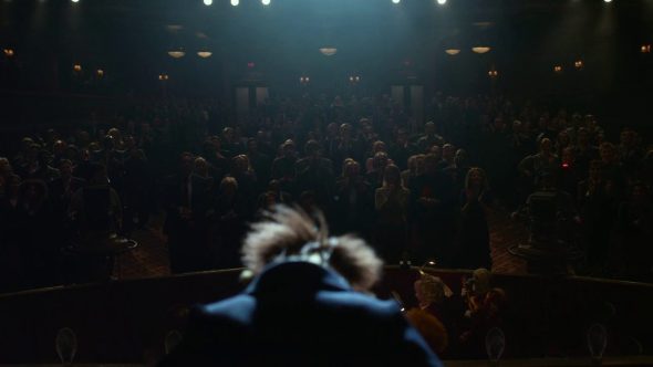 Screenshot from 'The Muppets' (2011): Walter taking a bow before an enthralled, applauding audience.