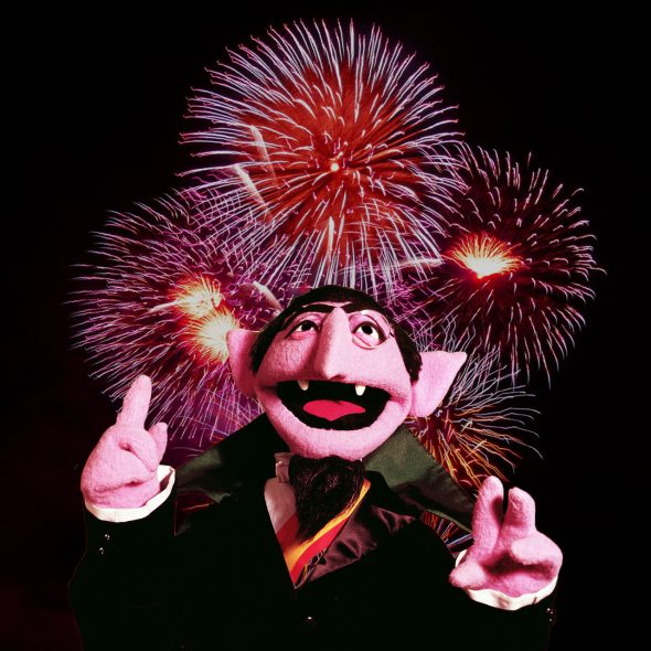 The Count in front of fireworks.