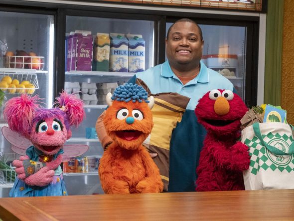 Abby, Rudy, Chris, and Elmo in Hooper's Store.