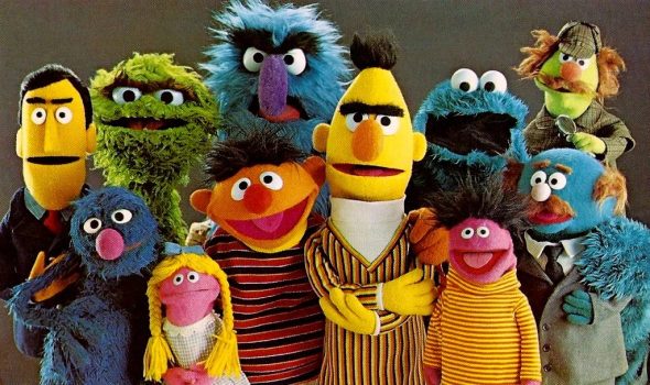 Old school photo of old school characters: Guy Smiley, Grover, Oscar, Betty Lou, Ernie, Herry, Bert, Cookie, Roosevelt Franklin, Mr. Johnson, and Sherlock Hemlock.